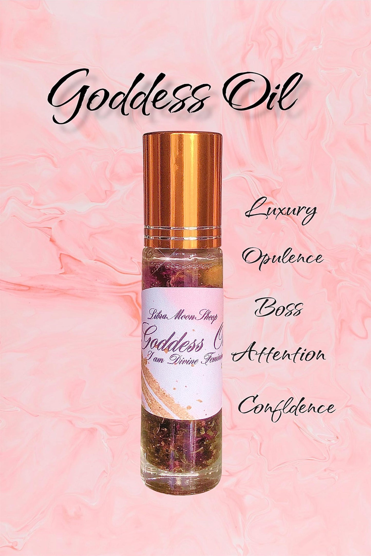 Goddess Beauty elixir Oil roller bottle with gold cap on a pink background with words luxury, opulence, boss, attraction, and confidence on a pink background. 