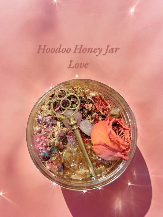 Hoodoo Honey Jar labeled 'Love' with a key and rose on a pink background with herbs and a vintage key. 